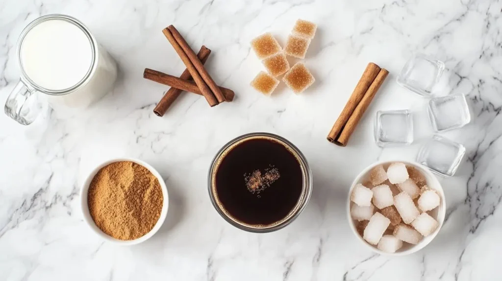 Ingredients for brown sugar shaken espresso: espresso, brown sugar, milk, cinnamon, and ice.