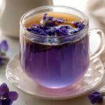 Purple Brazilian Mounjaro drink with lemon and mint for detox and metabolism boost